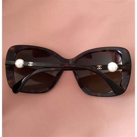 Chanel women’s sunglasses (Rx). Black, brown, & gray. Includes .